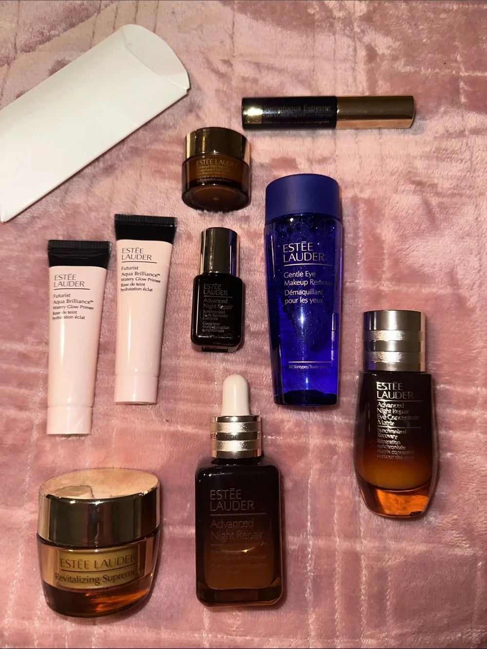 Estee Lauder Skincare Assortment with Blue, Pink, Gold and Brown Accents